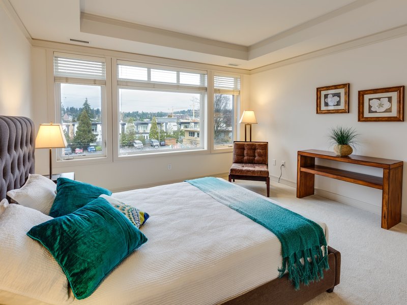 Bright bedroom with light carpet floors